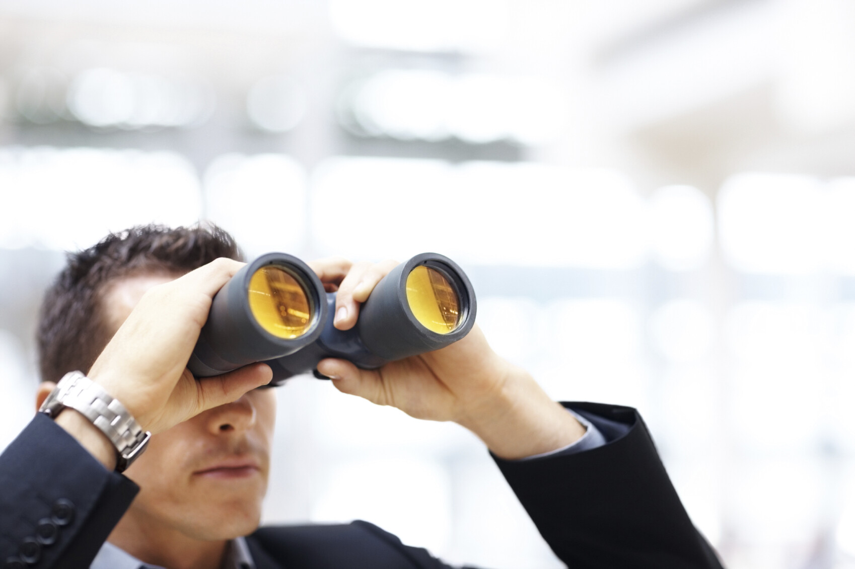 Man looking through binoculars.